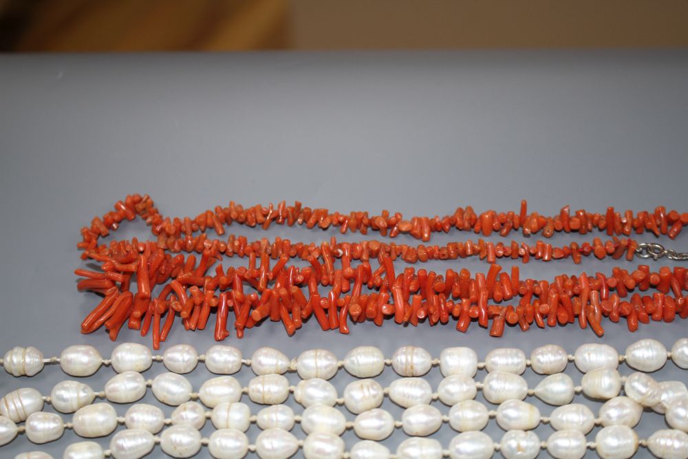 Two coral stick bead necklaces, a freshwater pearl necklace and three other costume necklaces,